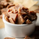 A white bowl filled with chunks of {{ $('Fetch Recipe Data').first().json["Main Keyword"] }}.